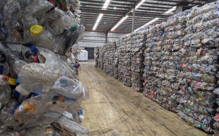 warehouse full of plastic bottles lining rows